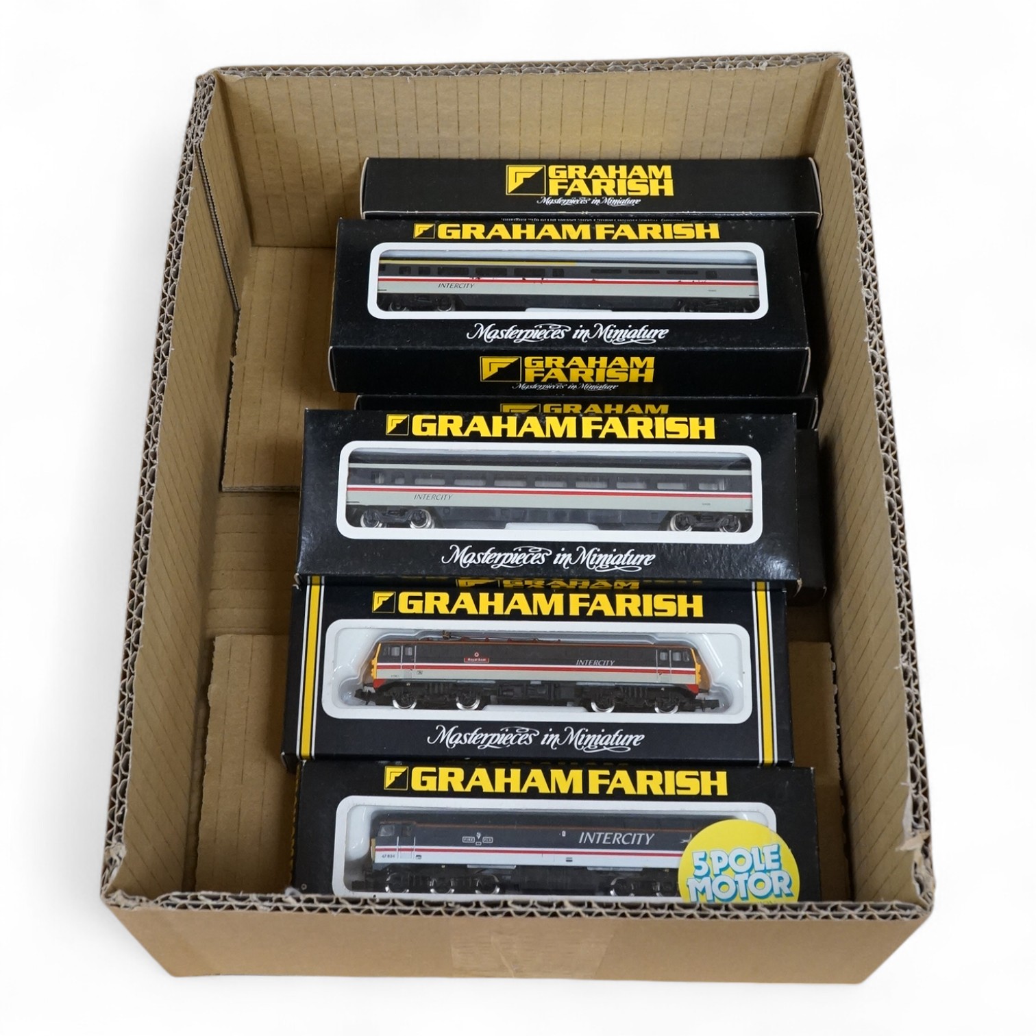 Seven boxed Graham Farish N gauge railway in BR Intercity livery, including two locomotives; a class 47 Fire Fly 47834 (8028), and a class 87 Royal Scot 87001 (8837), together with five bogie coaches. Condition - good.